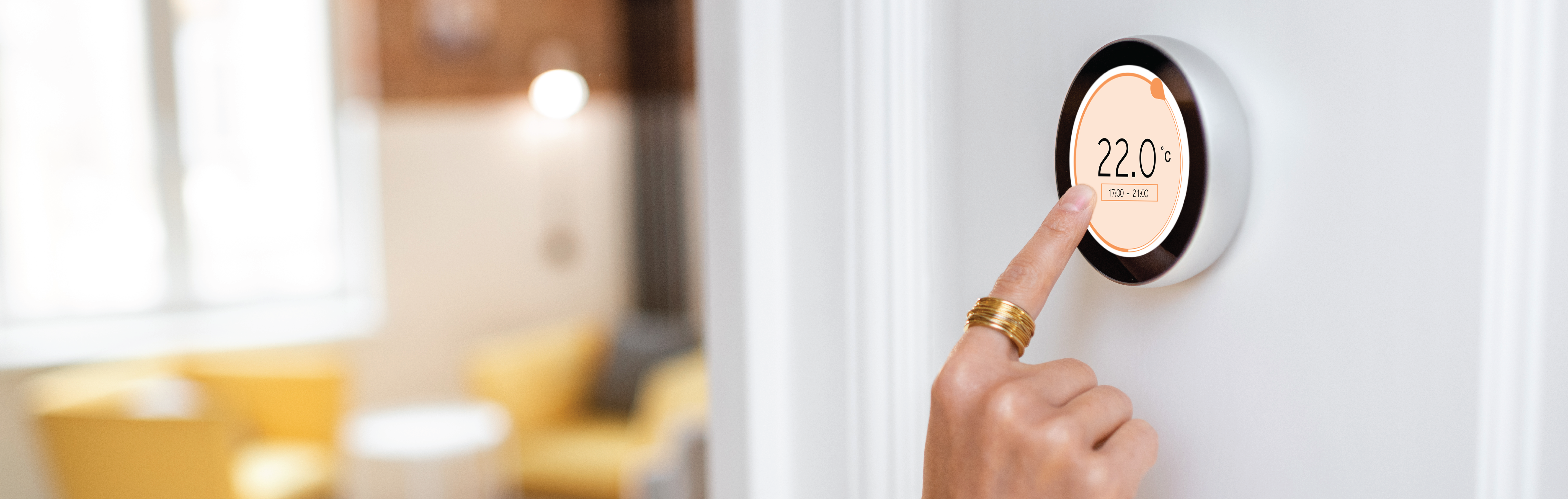 Person touching digital thermostat