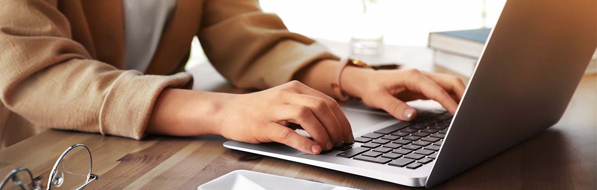 debunking HVAC myths - woman checking facts on laptop