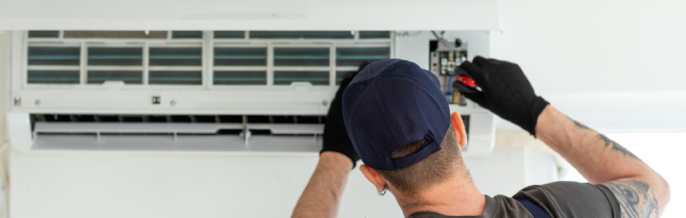 Technician repairing air conditioner